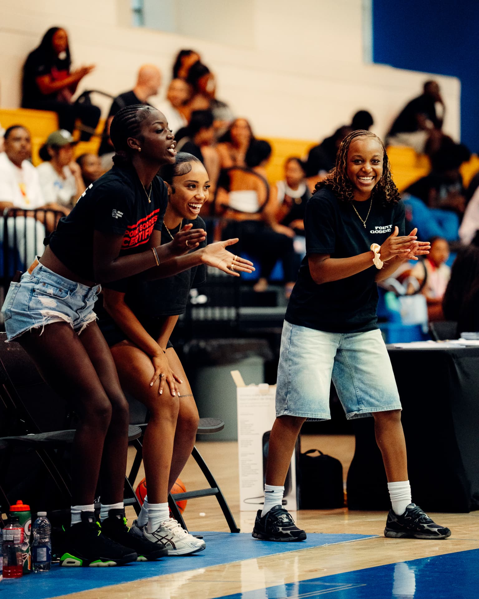 Point Goddess athletes cheering from the sideline