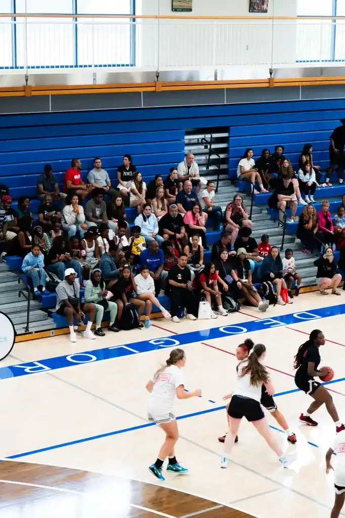 Game action in front of a full crowd of young supporters
